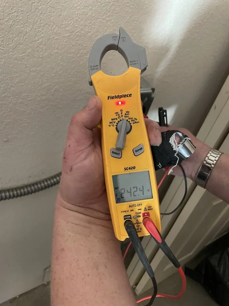Voltage testing with clamp meter during Recessed Lighting Installation in Port Wentworth